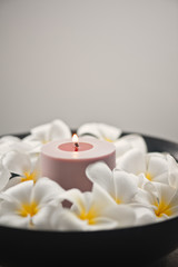 Fototapeta na wymiar Frangipani flower and candle decoration