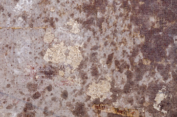 partially wet and weathered industrial surface