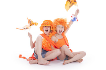 two girls in orange outfit cheering