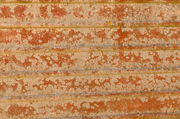 rusty metal surface with grooves and burst paint