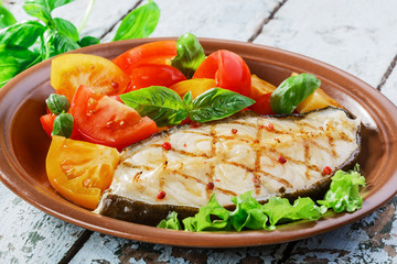 Fototapeta na wymiar fish steak grilled vegetables lancet fish