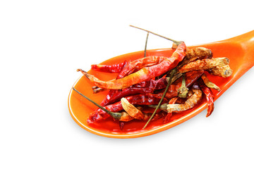 dried Chilli in a orange spoon isolated on a white backgrounds