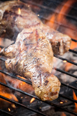 Grilled chicken leg on fire