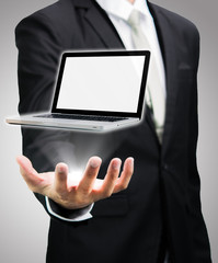 Businessman standing posture hand hold laptop isolated