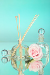 Aromatic sticks for home with floral odor on blue background