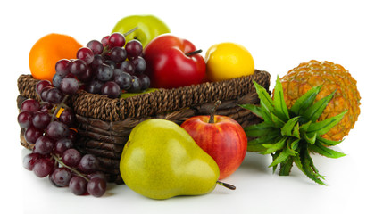 Ripe fruits in basket isolated on white