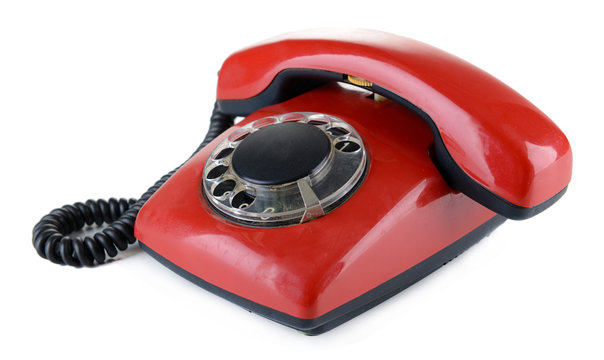 Red retro telephone, isolated on white