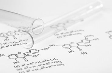 Test tubes and reaction formula, close-up
