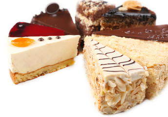 Assortment of pieces of cake, isolated on white © Africa Studio