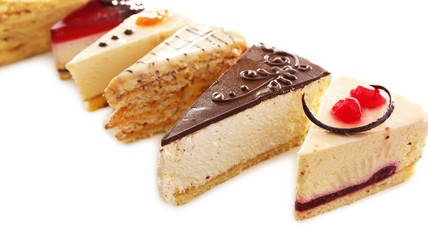 Assortment of pieces of cake, isolated on white © Africa Studio