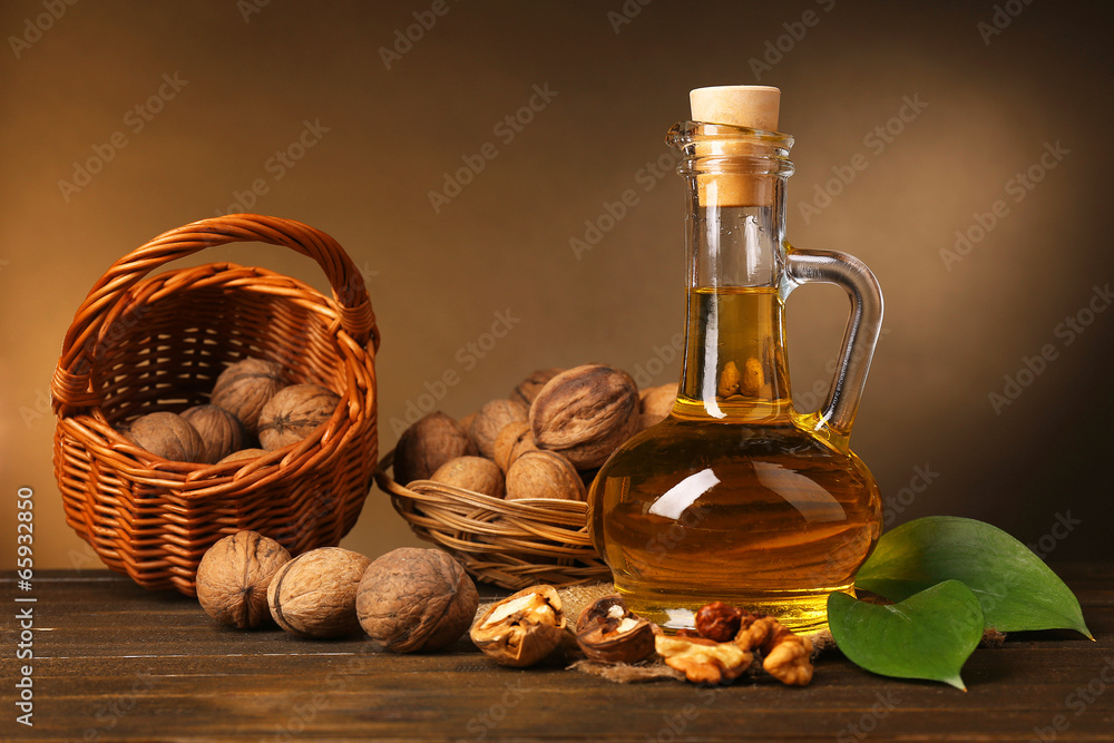 Poster walnut oil and nuts on wooden table - Posters
