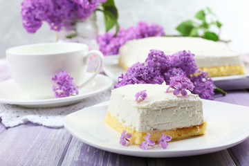 Delicious dessert with lilac flowers