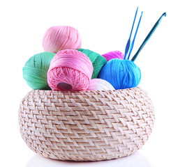 Colorful clews and crochet hooks in box isolated on white