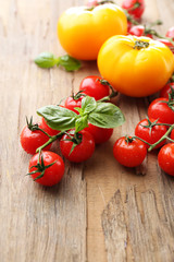 Fresh cherry tomatoes on old wooden table