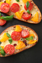 Tasty bruschetta with tomatoes in pan, close up