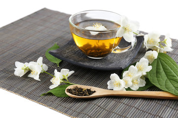 Obrazy na Plexi  Herbata jaśminowa na stole