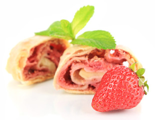 Tasty homemade strudel with fresh strawberry and mint leaves