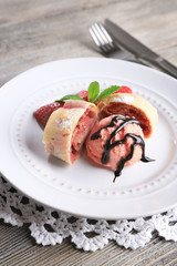 Tasty homemade strudel with ice-cream, fresh strawberry and