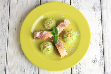 Tasty homemade apple strudel with nuts, mint leaves and