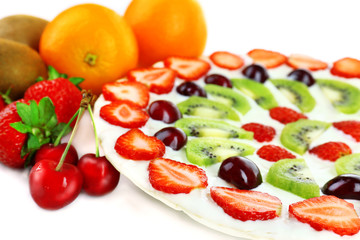 Homemade sweet pizza with fruits, close up