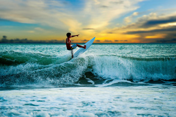 Athletic surfer with board - obrazy, fototapety, plakaty