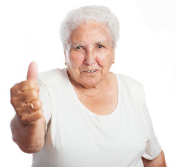 elder woman doing good symbol on a white background