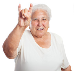 senior woman doing a rock symbol isolated on white