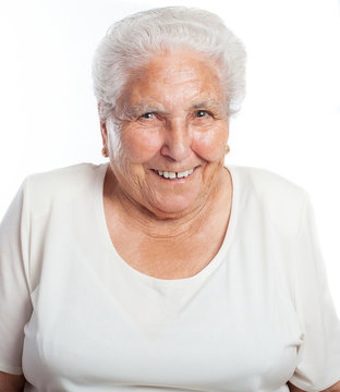 Eldery Woman Smiling Front On A White Background