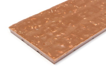 Whole chocolate with nuts and raisins on white background