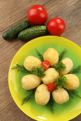 Young boiled potatoes on table, close up