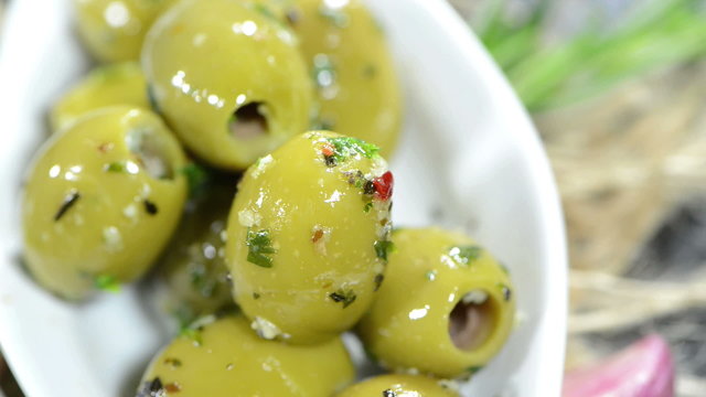 Green Olives in a small bowl as loopable full HD close-up video