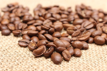 Heap of coffee on jute background