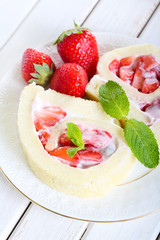 slices of strawberry roulade