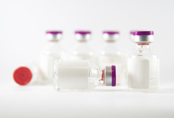 Purple cap injection vials show medicine concept