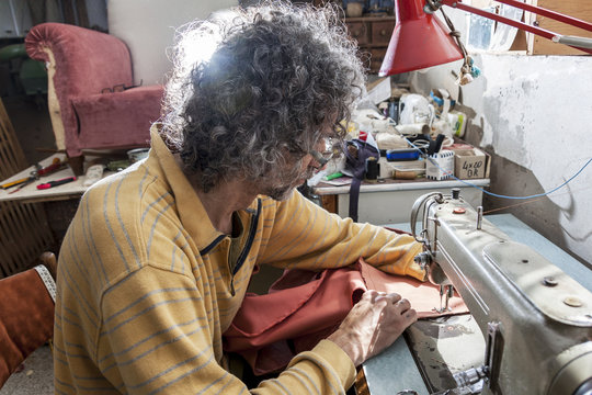 man at the sewing machine