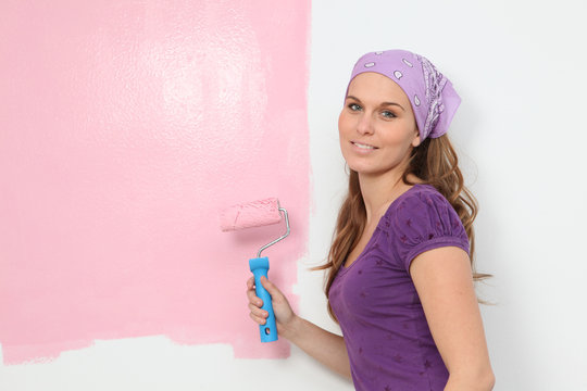 Woman Painting Baby Nursery Pink