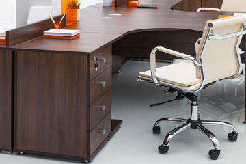 desks and white leather chairs
