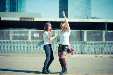 two beautiful young women dancing