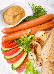Grilled sausages and vegetables