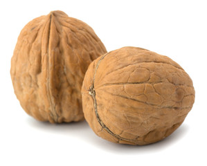whole and cracked walnut isolated on the white background