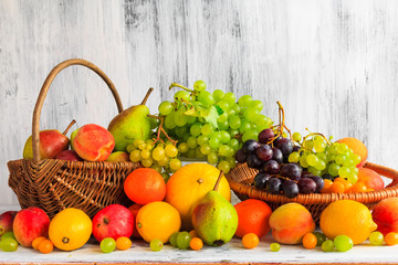 Wooden table full fresh fruit baskets
