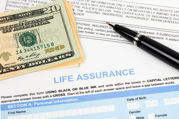 Life assurance application form with banknote and pen concept fo
