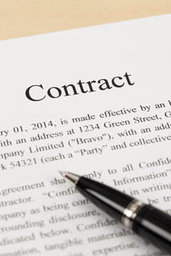 Business contract document with pen close-up