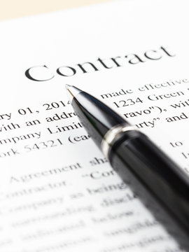 Business contract document focus on pen