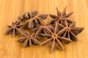 Anise stars on wooden board backgroud