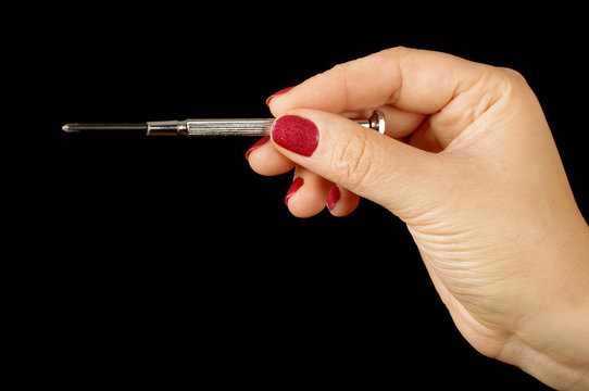 Woman hand holding philips screwdriver
