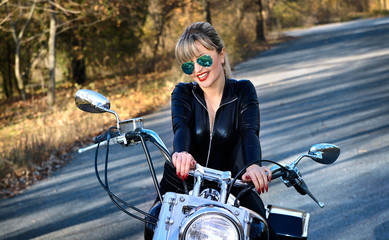 Fototapeta na wymiar Young beautiful woman and bike