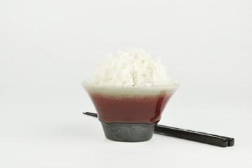 Rice in bowl and chopstick on white background