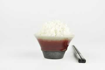 Rice in bowl and chopstick on white background