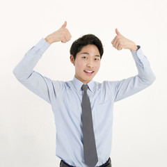 Success businessman thumb up